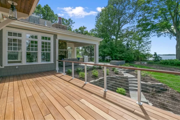 custom built wood deck overlooking beautiful backyard on water
