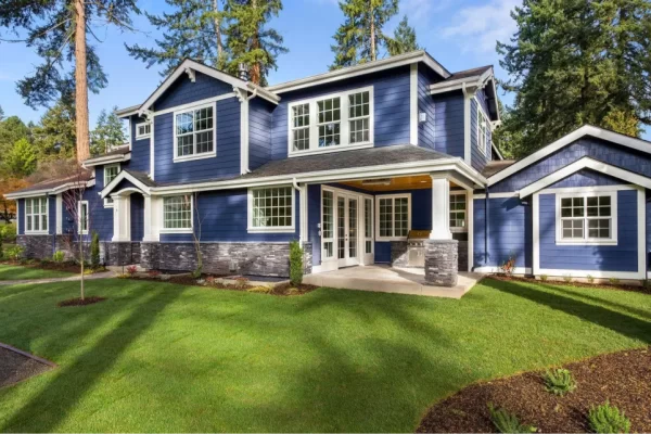 blue two story house with white trim, impact windows with white trim on blue house
